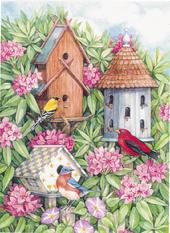 3 birdhouses with flowers and birds